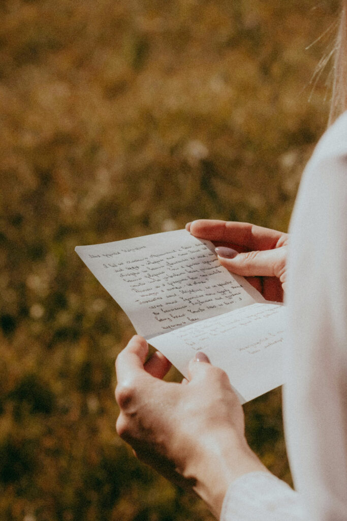 A person reading a hand written letter